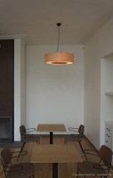 Big round pendant lamp in the shape of a donut, made of maple wood veneer of with several E27 light sockets inside
