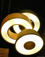 Lighting in the shape of a donut in tulip wood, both decorative and functional light