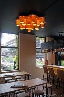 ceiling lights in maple wood above kitchen table